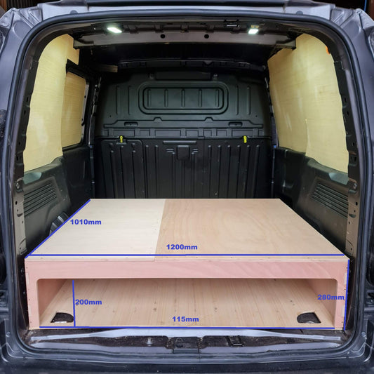 Measurement chart inside a vehicle's open trunk with a wooden platform.