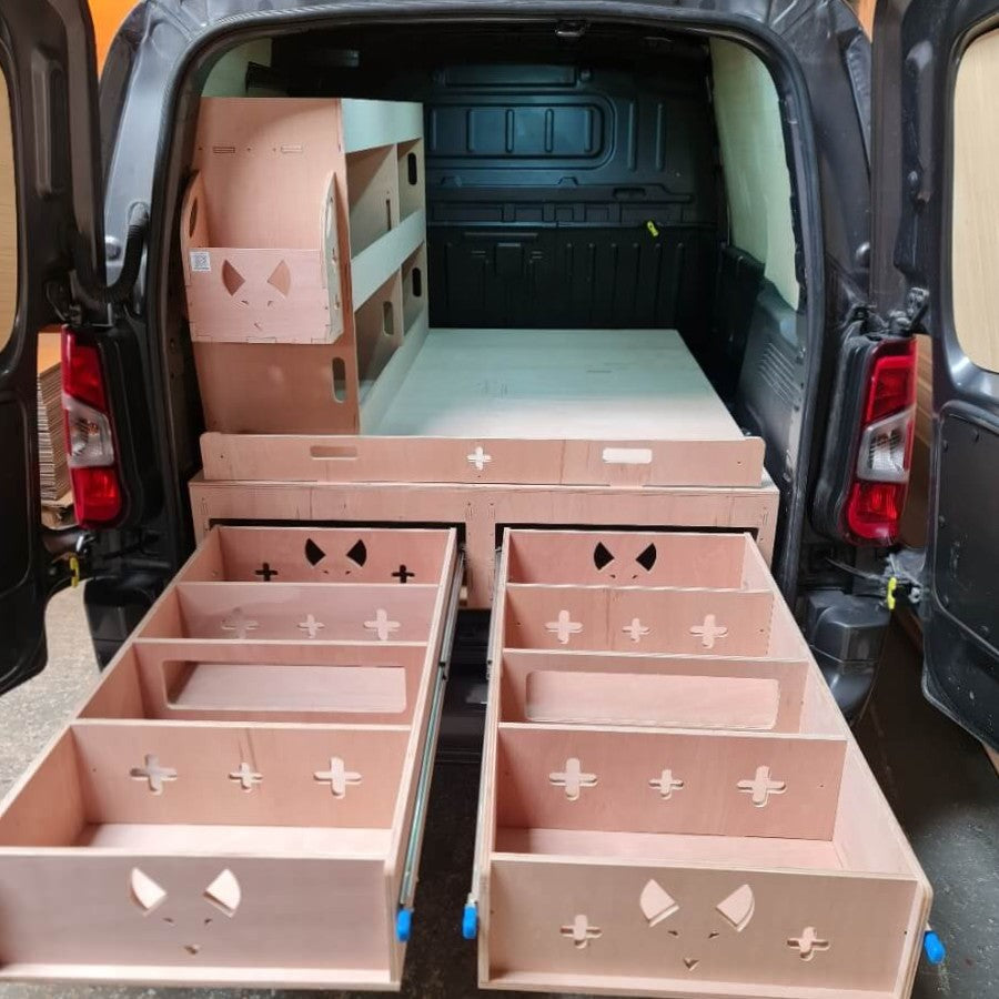 Citroen Berlingo drawers with geometric patterns inside an open van.