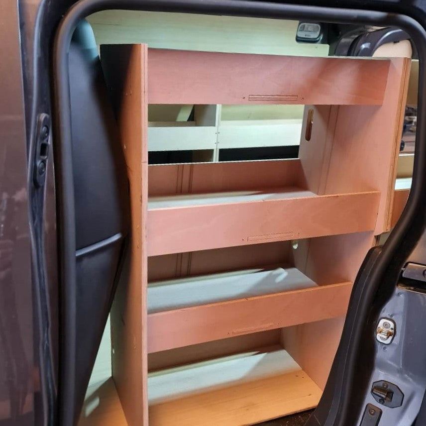 Wooden step ladder inside a vehicle