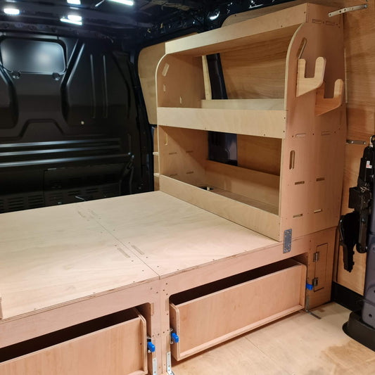 Wooden bed and storage system inside a van
