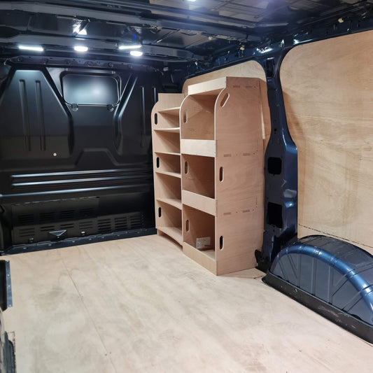 Wooden shelves inside a Ford Custom van with racking