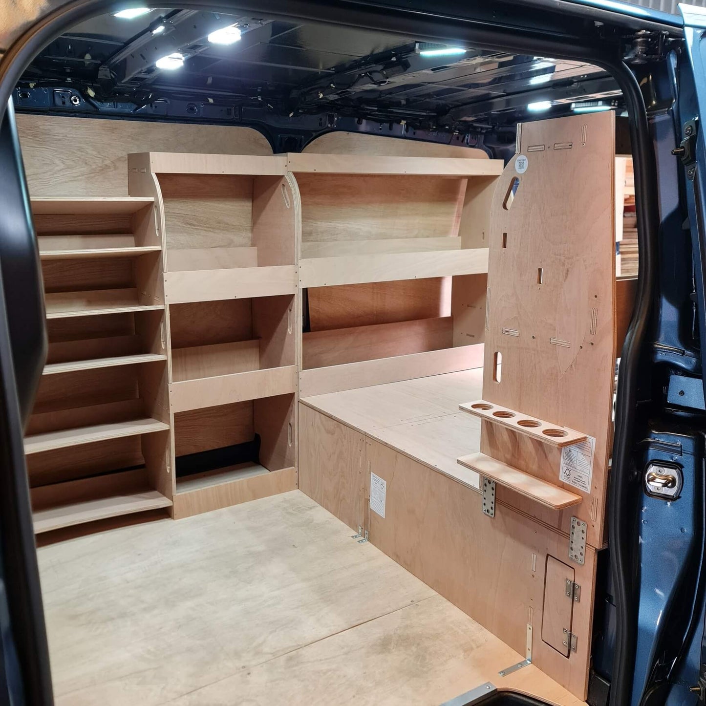 Wooden shelves and storage compartments inside a vehicle