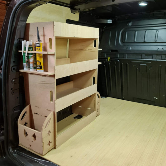 Wooden shelf system inside a vehicle with various items on it