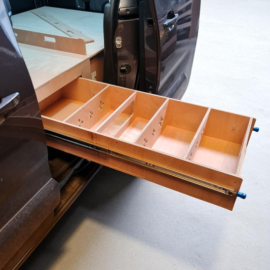 Wooden drawer with compartments inside a vehicle Peugeot Partner.