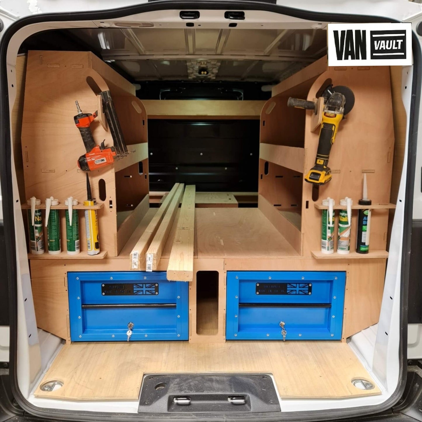 Van interior with organized tools and storage solutions branded 'Van Vault'.