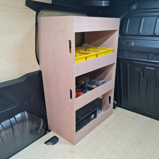 Wooden storage shelf with tools in a vehicle's cargo area