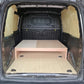 Wooden platform inside a van's cargo area