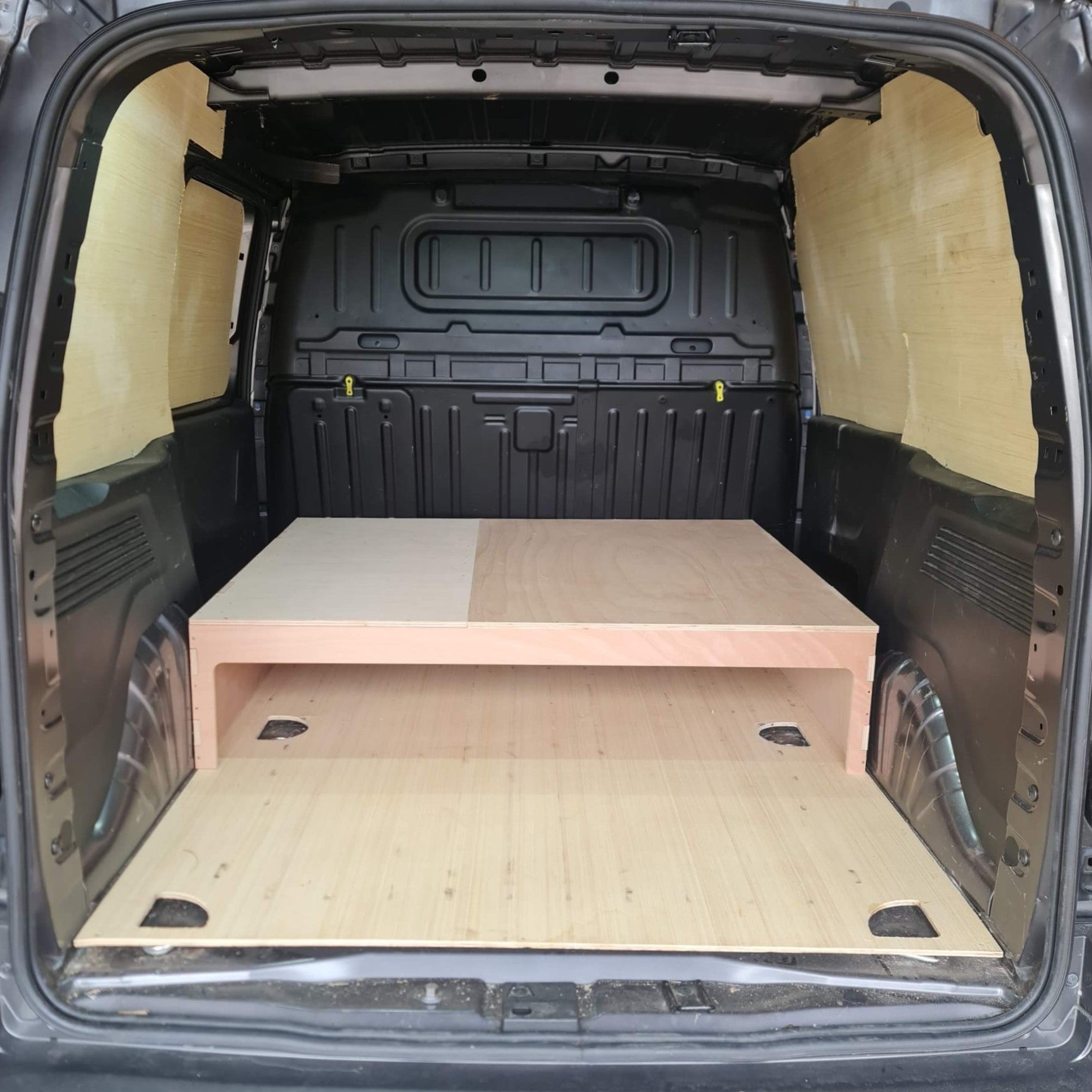 Wooden platform inside a van's cargo area