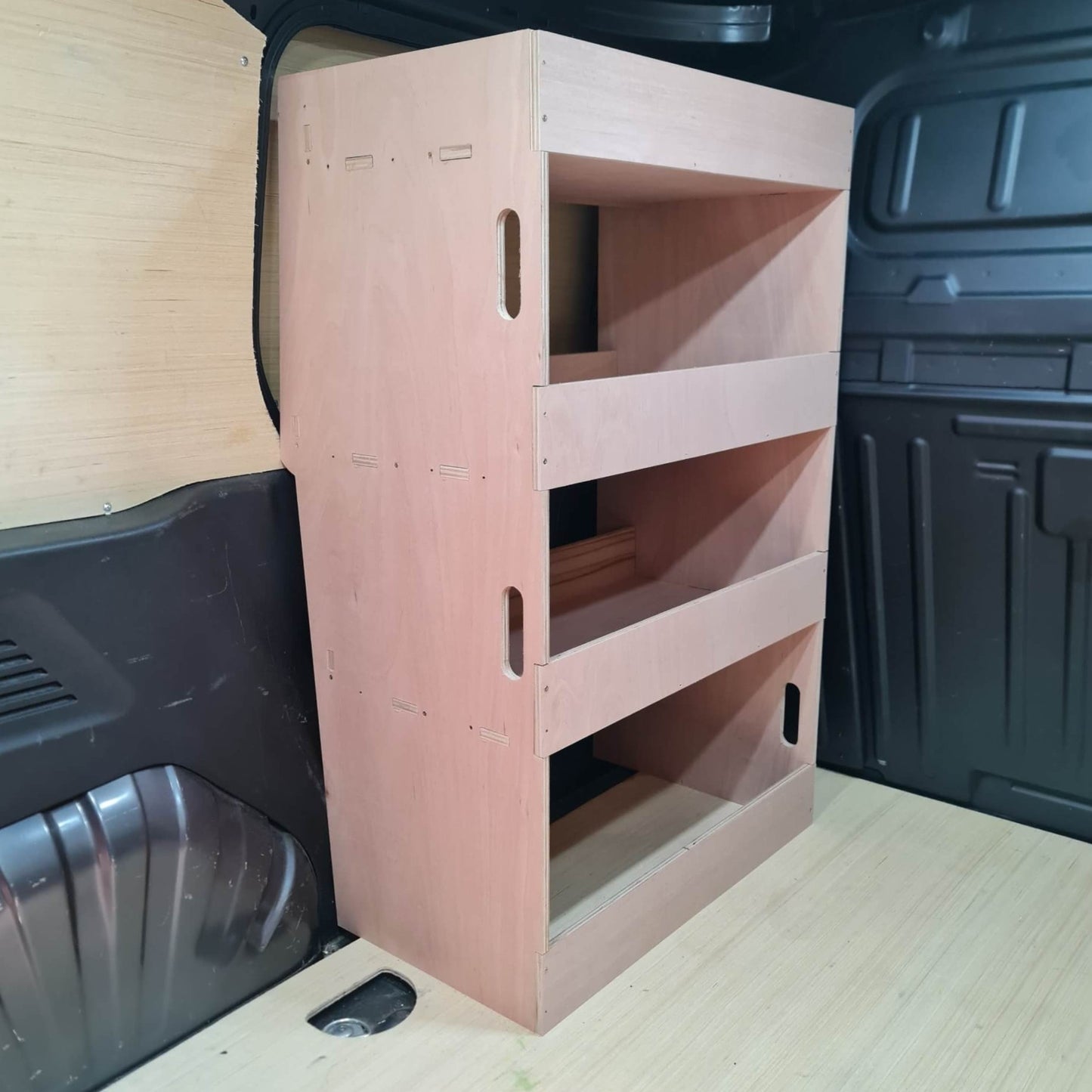 Wooden storage unit in the back of a vehicle