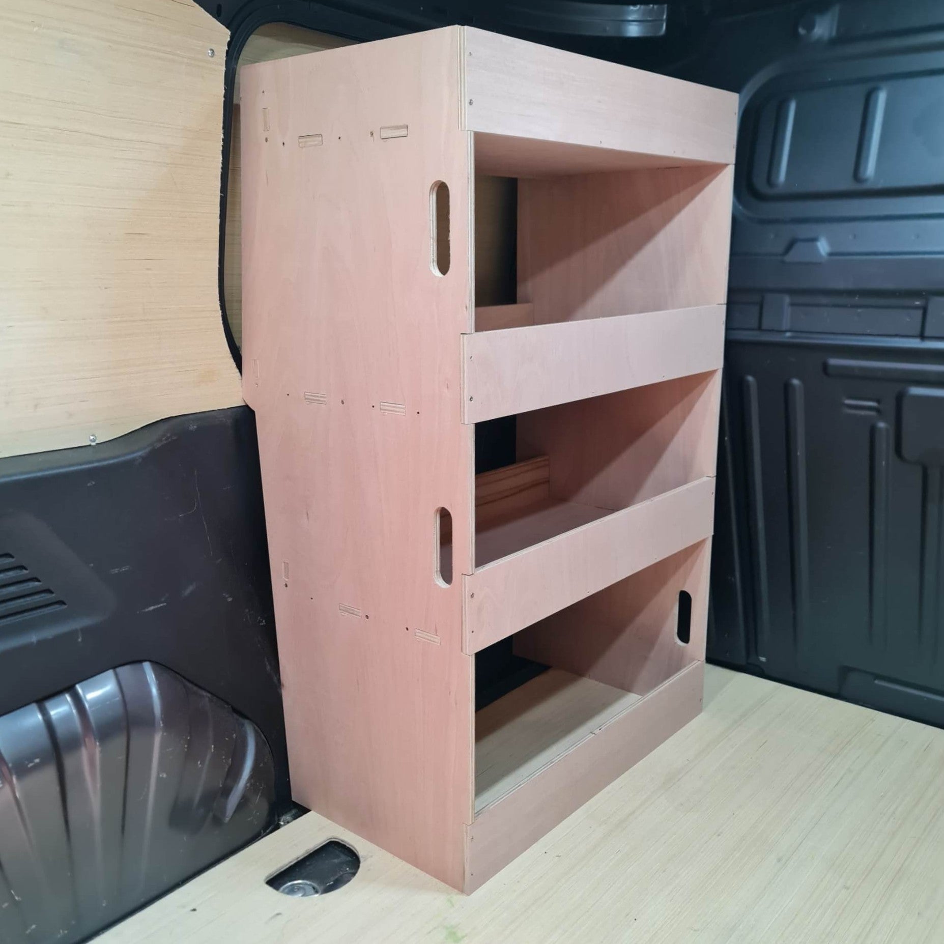 Wooden storage unit in the back of a vehicle