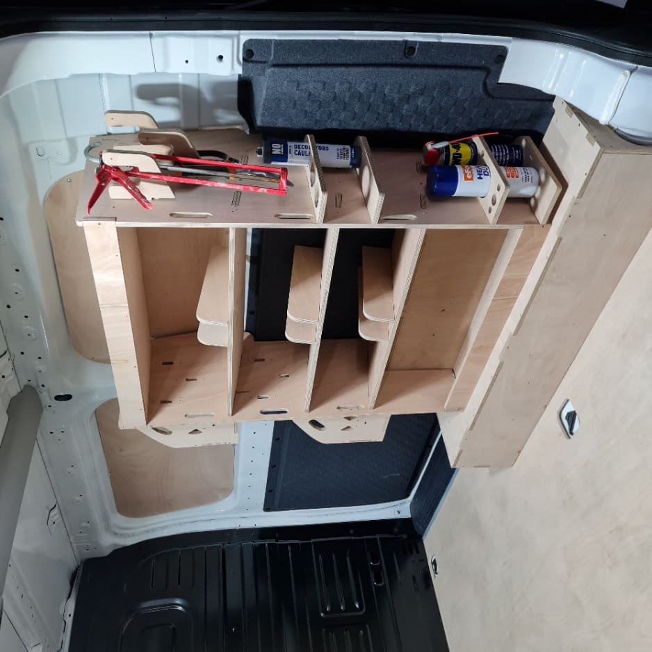 Kia PV5 racking system on raised floor with storage accessories