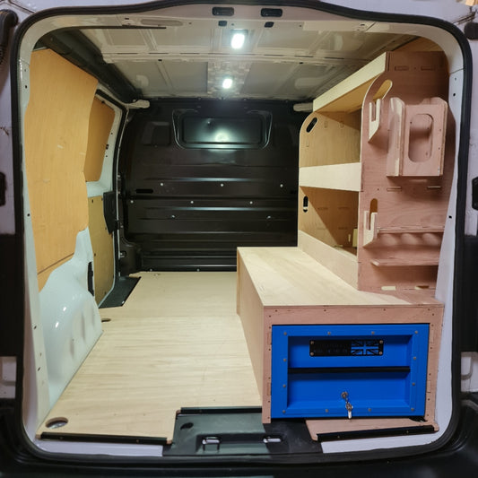 Open storage unit with wooden shelves and a blue vault