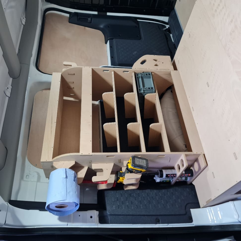 Wooden storage racking Kia PV5 with compartments in a vehicle's cargo area