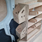 Compact Kia PV5 racking unit with hooks and compartments