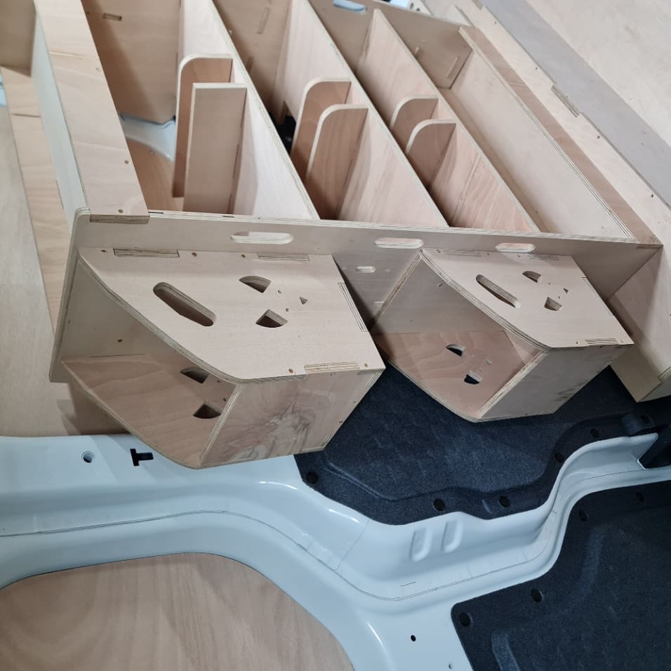 Compact Kia PV5 racking unit with hooks and compartments