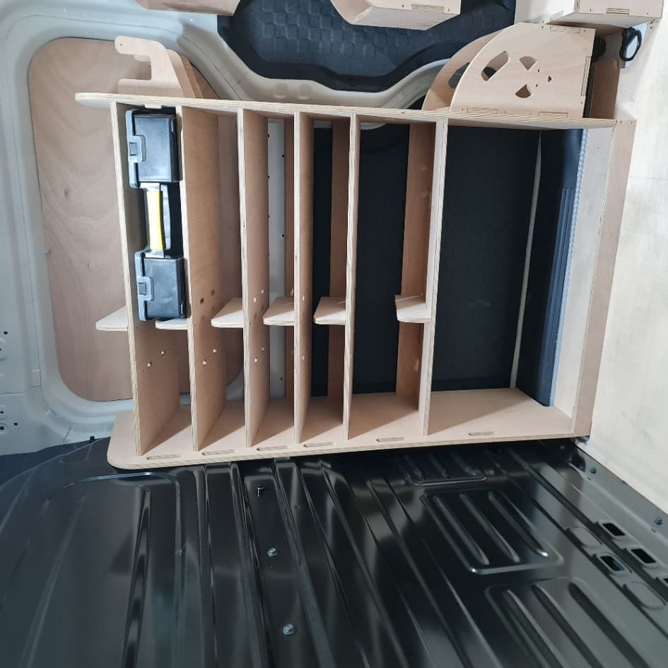 Wooden racking organizer inside a vehicle Kia PV5 trunk