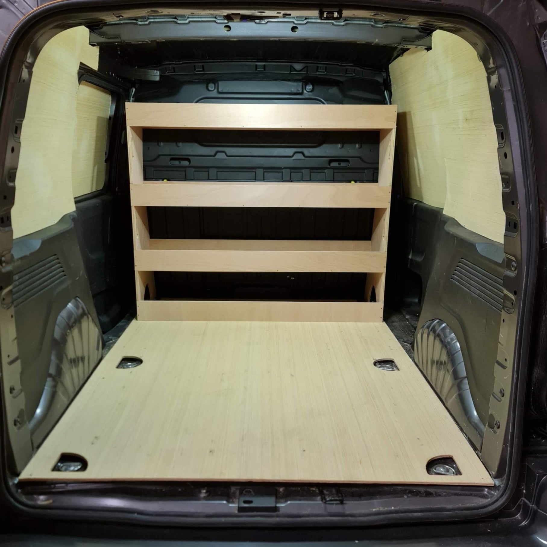 Wooden storage shelves and platform inside a Toyota ProAce City 