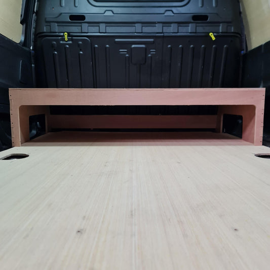 Plywood False floor with a black toolbox in the background