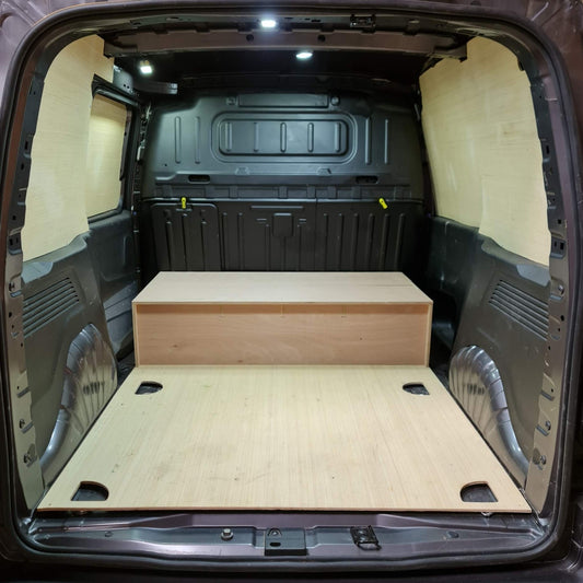 Van interior with wooden floor and storage compartment