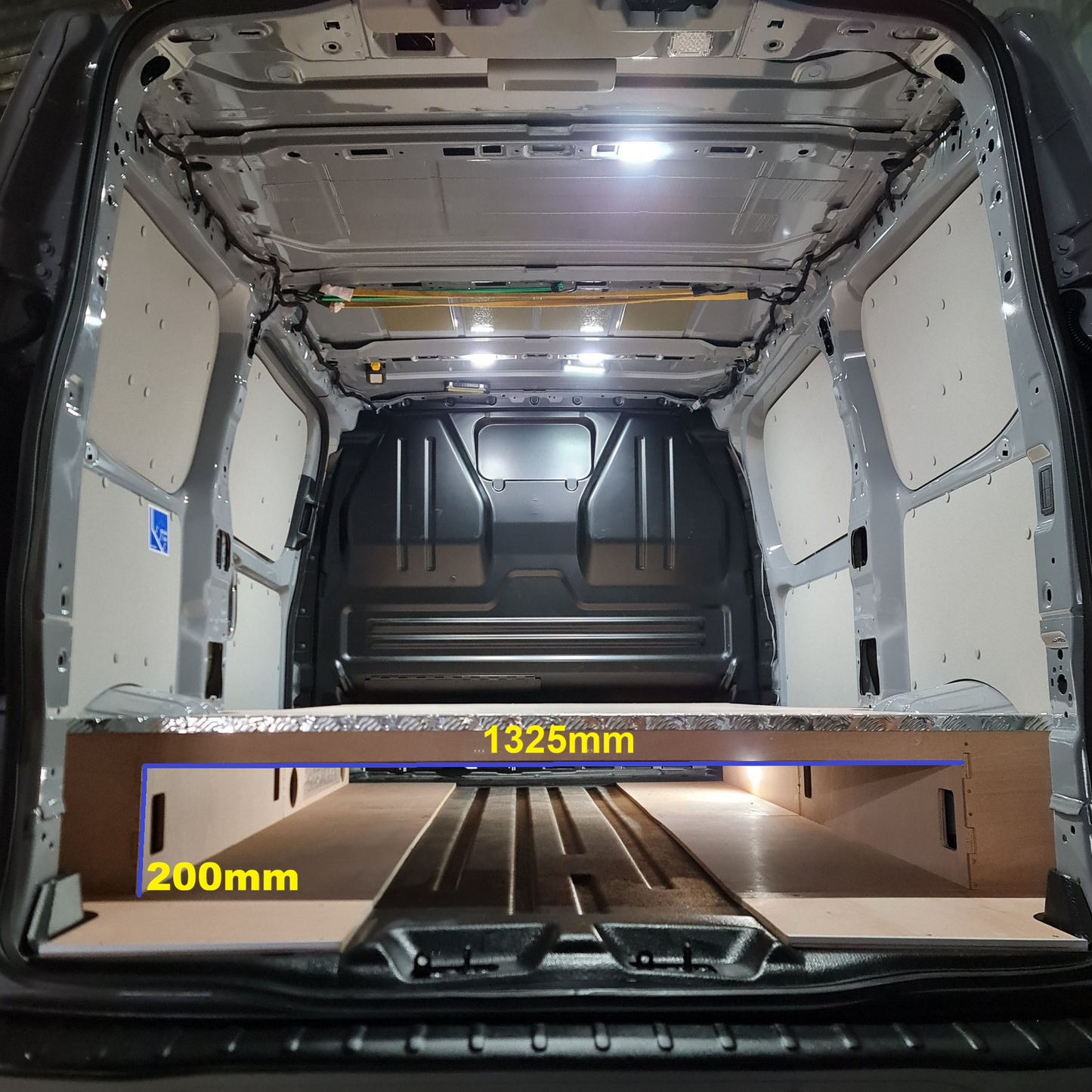 Full-length raised false floor installed in Ford Transit Custom SWB 2023+
