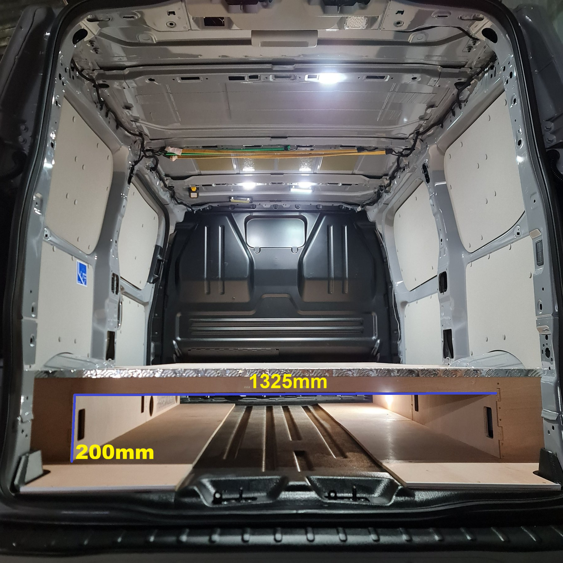 Full-length raised false floor installed in Ford Transit Custom SWB 2023+