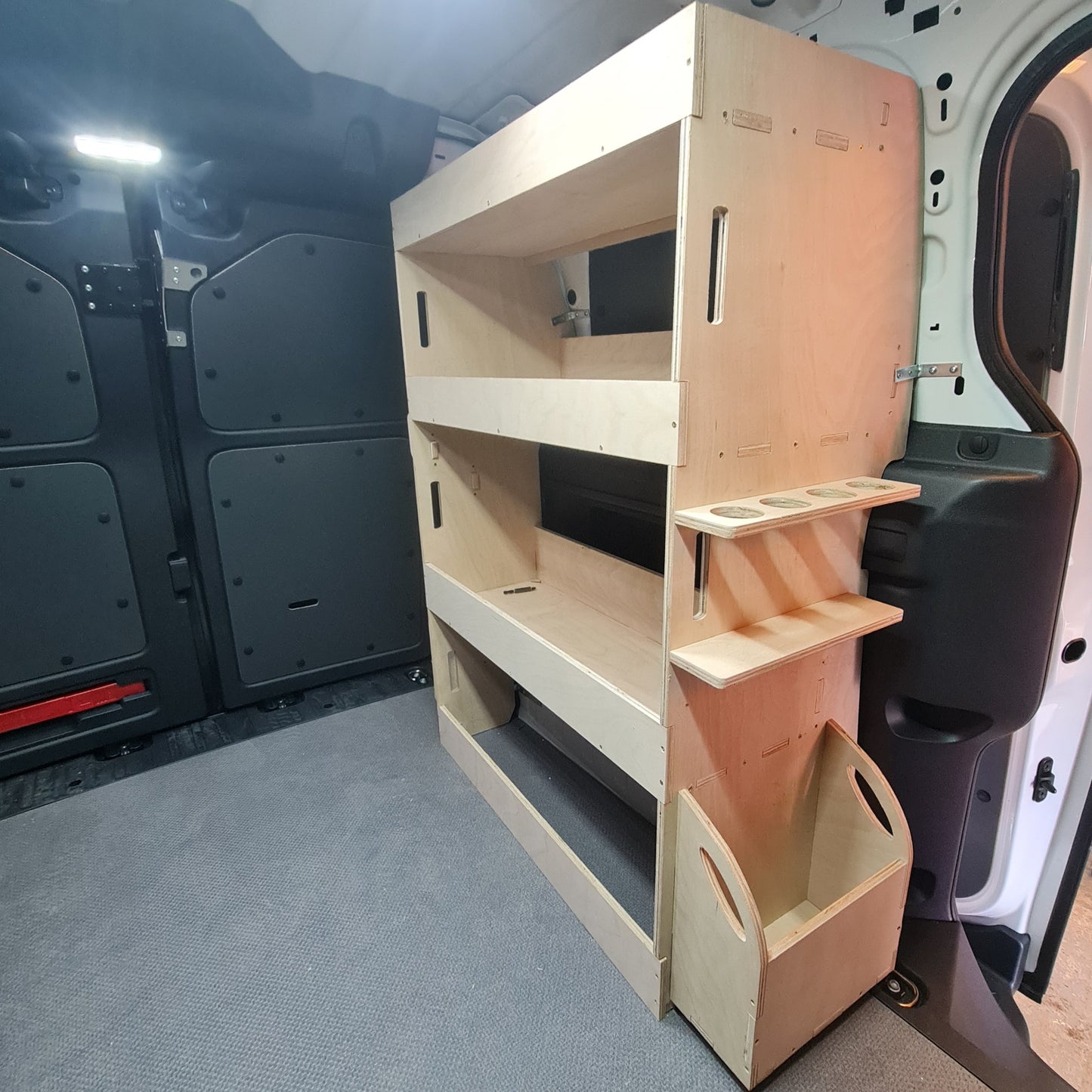 Wooden storage shelves inside a vehicle VW id Buzz