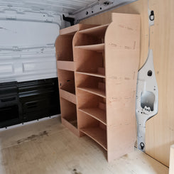 A set of beige plywood racks installed in the cargo area of a white Fiat Scudo van.