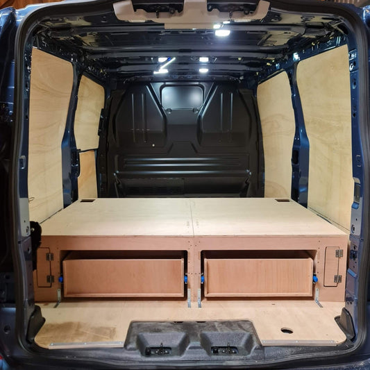 Van interior with wooden floor and storage compartments