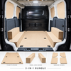 Kia PV5 interior with full plywood floor, twin wheel arch boxes and sliding door window covers
