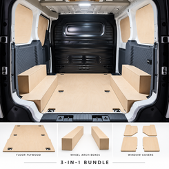 Kia PV5 interior with full plywood floor, twin wheel arch boxes and sliding door window covers