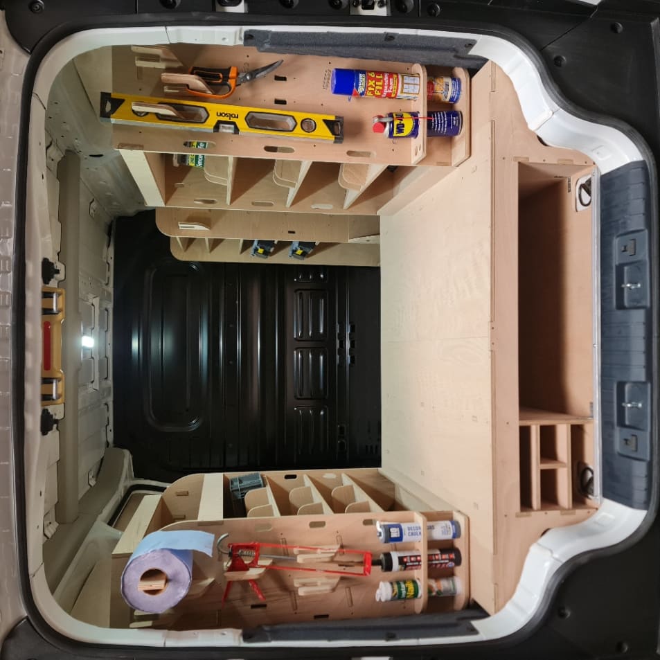Kia PV5 professional van storage system with toolboxes and hooks