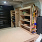 Custom Kia PV5 van racking with spray can and silicone tube holders