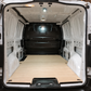 Toyota Proace van cargo area with fitted plywood floor panel and clean white metal interior walls