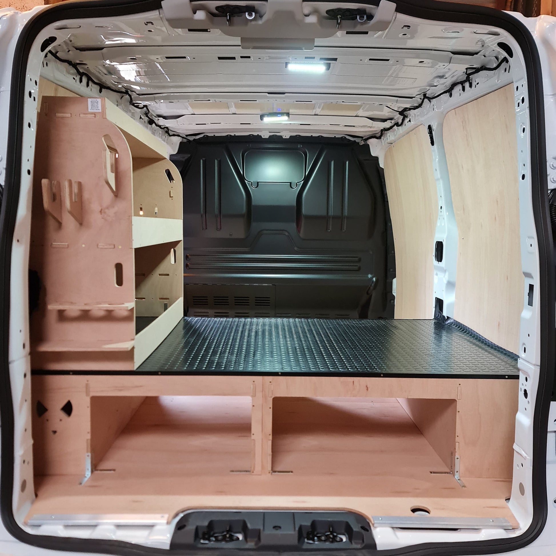 Raised false floor system for Toyota Proace with shelving racking and silicone tube storage for four tubes
