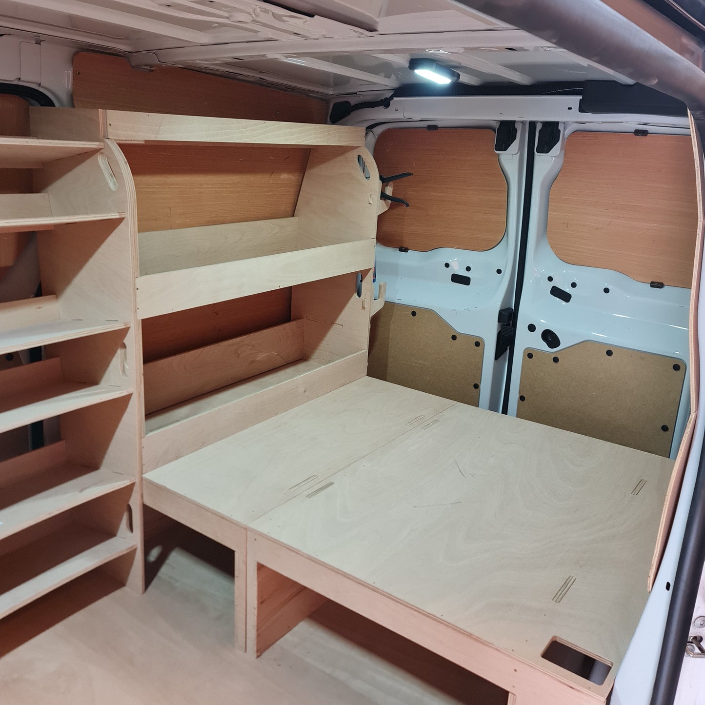 Toyota Proace 12mm plywood van racking system with false floor and driver side shelving for tradespeople and contractors