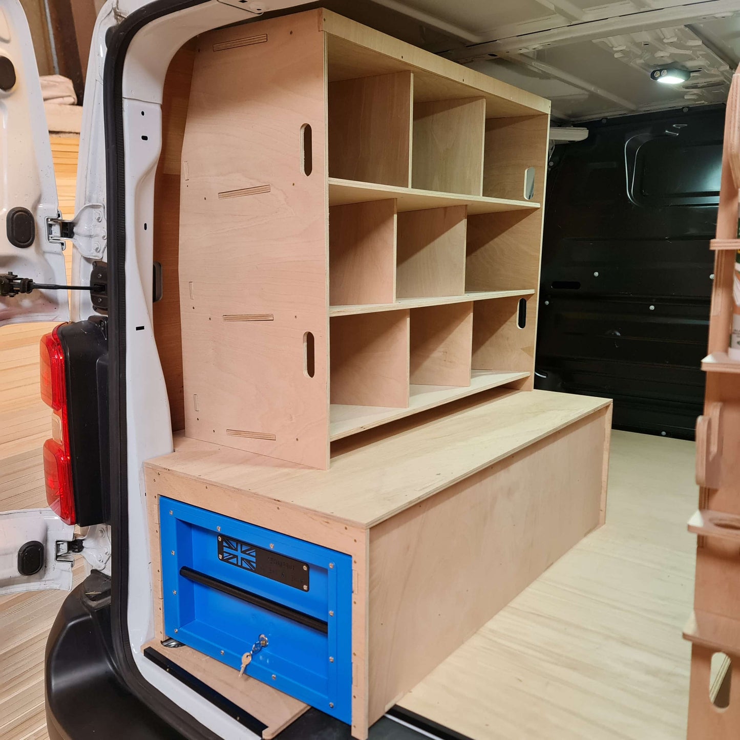 Vauxhall Vivaro plywood false floor and van racking setup for work van organisation