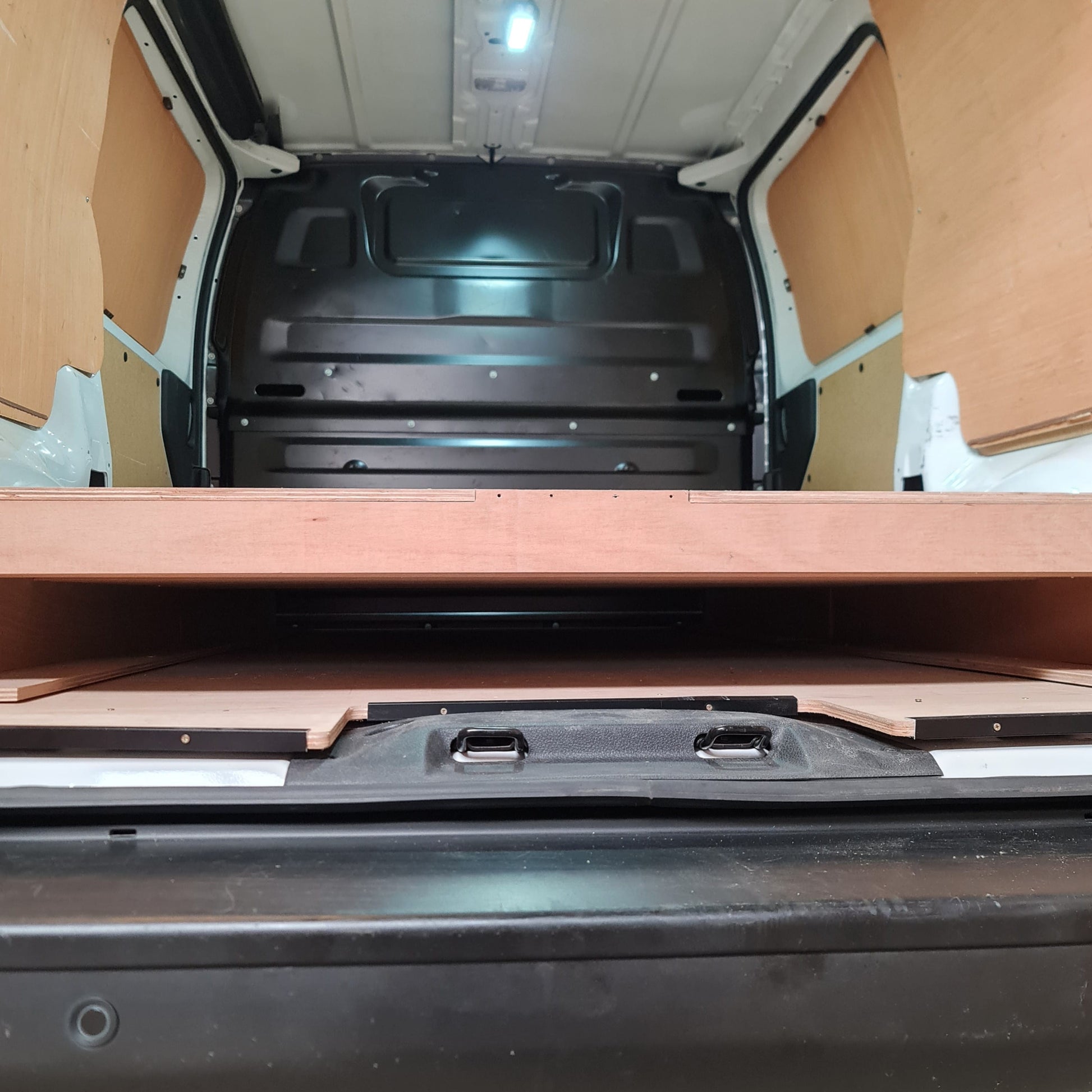 Vauxhall Vivaro underfloor pipe storage with open full-length false floor
