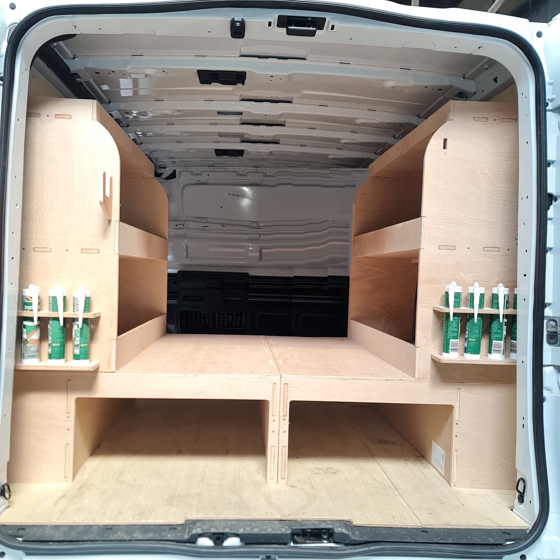 Complete installed racking system showing fully organised mobile workshop setup inside van