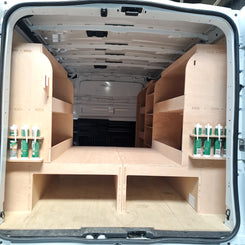 van setup with full racking system and raised floor creating organised mobile workshop space