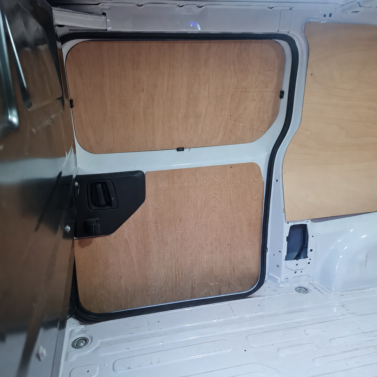 Vauxhall Vivaro rear door plywood lining panels with black aluminium edge trim