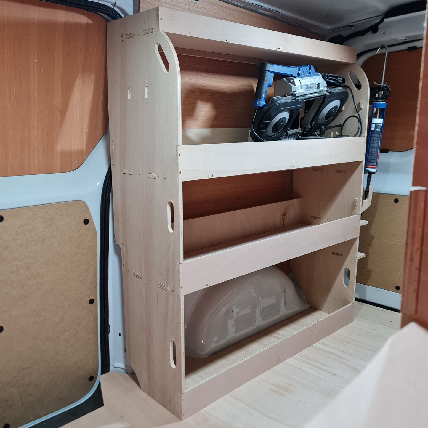 Vauxhall Vivaro tool storage shelving with compact plywood shelves and silicone tube holder