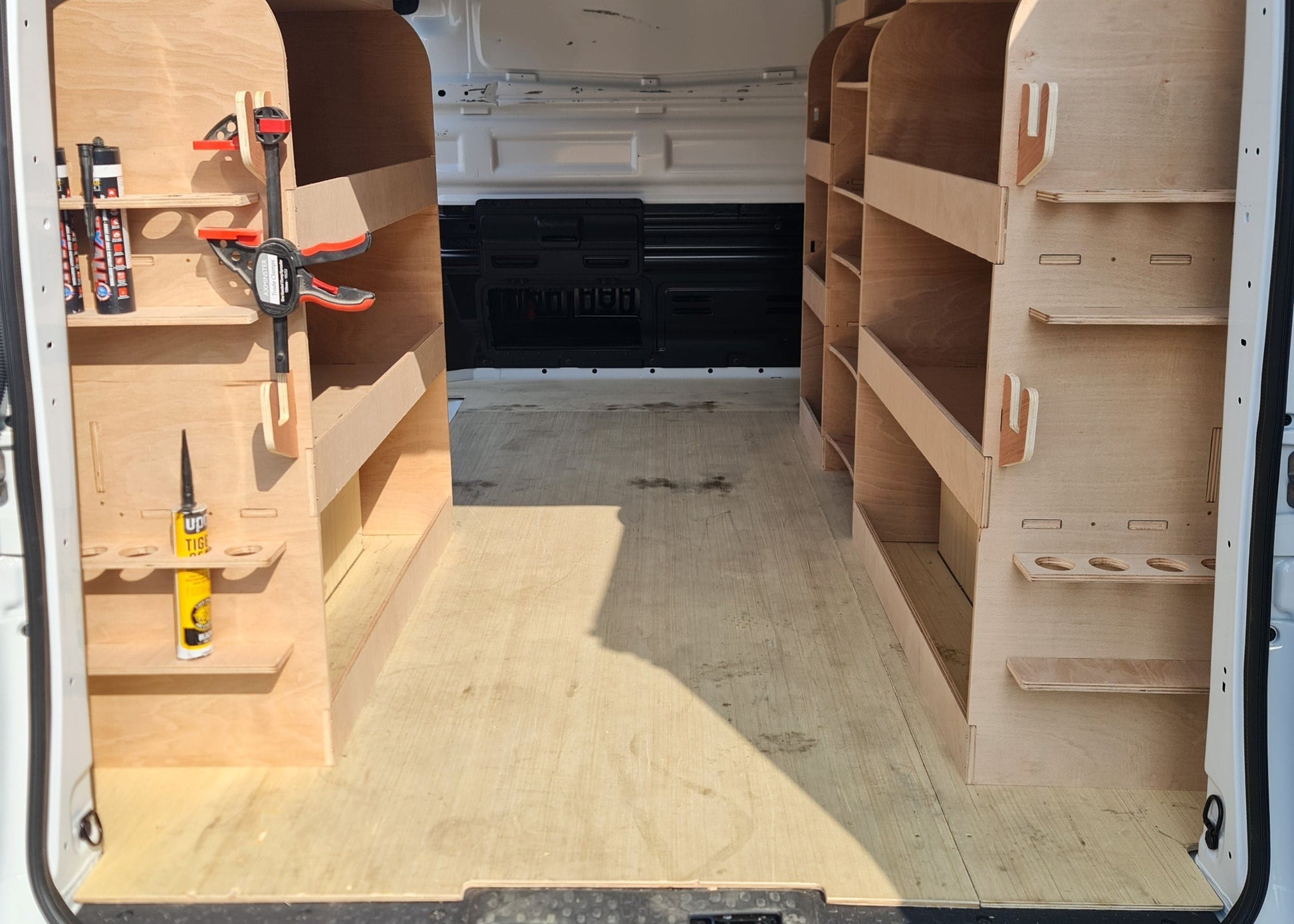 Driver side full-length racking system with tool and drill storage compartments